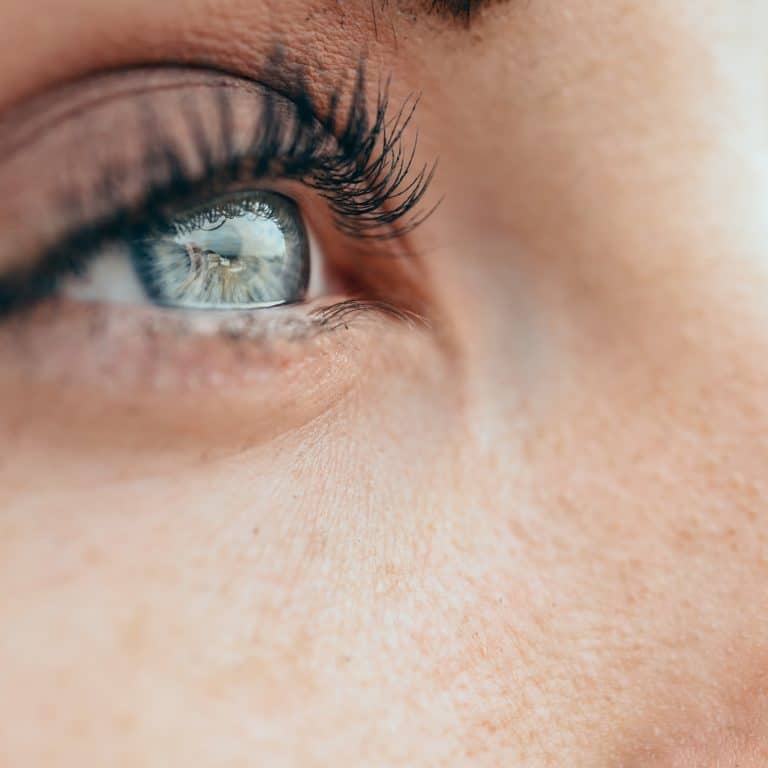 Make-up beautiful young woman's blue eyes